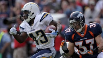 DENVER - SEPTEMBER 14: Darren Sproles #43 of the San Diego Chargers rushes as Calvin Lowry #37 of the Denver Broncos pursues during NFL action at Invesco Field at Mile High on September 14, 2008 in Denver, Colorado. The Broncos defeated the Chargers 39-38. (Photo by Doug Pensinger/Getty Images)