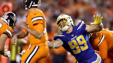 SAN DIEGO, CA - OCTOBER 13: Joey Bosa #99 of the San Diego Chargers pressures Trevor Siemian #13 of the Denver Broncos during the first half of a game at Qualcomm Stadium on October 13, 2016 in San Diego, California. (Photo by Sean M. Haffey/Getty Images)