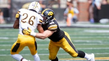 IOWA CITY, IOWA- SEPTEMBER 2: Linebacker Josey Jewell #43 of the Iowa Hawkeyes makes a tackle during the third quarter on wide receiver Avante' Cox #26 of the Wyoming Cowboys on September 2, 2017 at Kinnick Stadium in Iowa City, Iowa. (Photo by Matthew Holst/Getty Images)