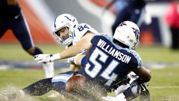 NASHVILLE, TN - OCTOBER 16: Jack Doyle #84 of the Indianapolis Colts fumbles the ball as he is tackled by Avery Williamson #54 of the Tennessee Titans during the game at Nissan Stadium on October 16, 2017 in Nashville, Tennessee. (Photo by Andy Lyons/Getty Images)