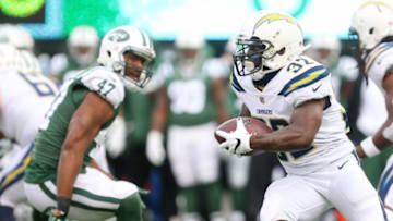 EAST RUTHERFORD, NJ - DECEMBER 24: Branden Oliver #32 of the Los Angeles Chargers runs the ball during the first half against the New York Jets in an NFL game at MetLife Stadium on December 24, 2017 in East Rutherford, New Jersey. (Photo by Ed Mulholland/Getty Images)
