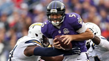 BALTIMORE, MD - NOVEMBER 01: Quarterback Joe Flacco #5 of the Baltimore Ravens is sacked by a pair of San Diego Chargers defenders during the second half at M&T Bank Stadium on November 1, 2015 in Baltimore, Maryland. (Photo by Patrick Smith/Getty Images)