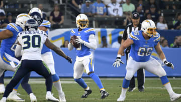 CARSON, CA - AUGUST 24: Bradley McDougald #30 of the Seattle Seahawks rushes while Tyrod Taylor #5 of the Los Angeles Chargers drops back to pass and Dan Feeney #66 of the Los Angeles Chargers blocks during a preseason NFL football game at Dignity Health Sports Park on August 24, 2019 in Carson, California. The Seattle Seahawks won 23-15. (Photo by John McCoy/Getty Images)