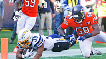 CHICAGO, ILLINOIS - OCTOBER 27: Austin Ekeler #30 of the Los Angeles Chargers scores a touchdown in front of Roquan Smith #58 of the Chicago Bears during the second half at Soldier Field on October 27, 2019 in Chicago, Illinois. (Photo by Nuccio DiNuzzo/Getty Images)