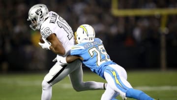 OAKLAND, CALIFORNIA - NOVEMBER 07: Wide receiver Tyrell Williams #16 of the Oakland Raiders is tackled by cornerback Casey Hayward #26 of the Los Angeles Chargers during the first quarter at RingCentral Coliseum on November 07, 2019 in Oakland, California. (Photo by Ezra Shaw/Getty Images)