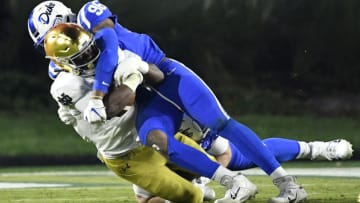DURHAM, NORTH CAROLINA - NOVEMBER 09: Chris Rumph II #96 of the Duke Blue Devils tackles Jahmir Smith #34 of the Notre Dame Fighting Irish during the second half of their game at Wallace Wade Stadium on November 09, 2019 in Durham, North Carolina. (Photo by Grant Halverson/Getty Images)