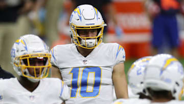 NEW ORLEANS, LOUISIANA - OCTOBER 12: Justin Herbert #10 of the Los Angeles Chargers walks on the field during their NFL game against the New Orleans Saints at Mercedes-Benz Superdome on October 12, 2020 in New Orleans, Louisiana. (Photo by Chris Graythen/Getty Images)