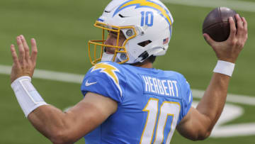 INGLEWOOD, CALIFORNIA - DECEMBER 27: Justin Herbert #10 of the Los Angeles Rams warms up before playing against the Denver Broncos at SoFi Stadium on December 27, 2020 in Inglewood, California. (Photo by Sean M. Haffey/Getty Images)