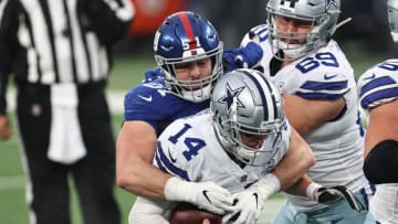 EAST RUTHERFORD, NEW JERSEY - JANUARY 03: Andy Dalton #14 of the Dallas Cowboys is sacked by Kyler Fackrell #51 of the New York Giants during the third quarter at MetLife Stadium on January 03, 2021 in East Rutherford, New Jersey. (Photo by Elsa/Getty Images)