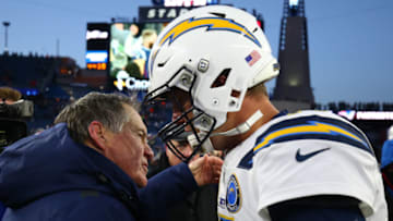 FOXBOROUGH, MASSACHUSETTS - JANUARY 13: Head coach Bill Belichick of the New England Patriots hugs Philip Rivers #17 of the Los Angeles Chargers after the AFC Divisional Playoff Game at Gillette Stadium on January 13, 2019 in Foxborough, Massachusetts. (Photo by Adam Glanzman/Getty Images)
