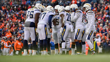 DENVER, CO - DECEMBER 30: The Los Angeles Chargers offense huddles around d quarterback Philip Rivers #17 in the second quarter of a game against the Denver Broncos at Broncos Stadium at Mile High on December 30, 2018 in Denver, Colorado. (Photo by Dustin Bradford/Getty Images)