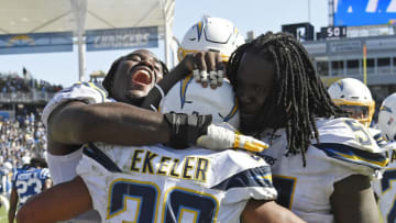 CARSON, CA - SEPTEMBER 08: Running back Austin Ekeler #30 of the Los Angeles Chargers is congratulated by Justin Jones #93 and Melvin Ingram #54 after scoring the winning touchdown in overtime against Indianapolis Colts at Dignity Health Sports Park on September 8, 2019 in Carson, California. (Photo by Kevork Djansezian/Getty Images)