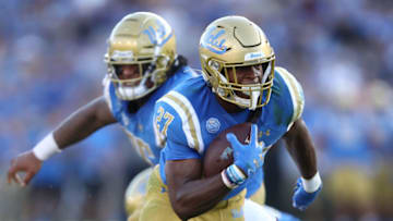 LOS ANGELES, CALIFORNIA - OCTOBER 26: Joshua Kelley #27 of the UCLA Bruins runs with the ball for short yardage during the first half of a game against the Arizona State Sun Devils on October 26, 2019 in Los Angeles, California. (Photo by Sean M. Haffey/Getty Images)