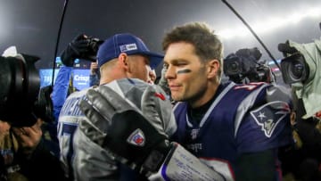 FOXBOROUGH, MASSACHUSETTS - JANUARY 04: Ryan Tannehill #17 of the Tennessee Titans is congratulated by Tom Brady #12 of the New England Patriots after their 20-13 win in the AFC Wild Card Playoff game at Gillette Stadium on January 04, 2020 in Foxborough, Massachusetts. (Photo by Maddie Meyer/Getty Images)