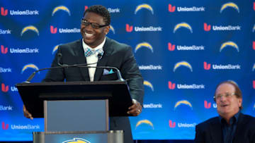 SAN DIEGO, CA - JUNE 18: LaDainian Tomlinson speaks as San Diego Chargers owner Dean Spanos during his announcement of his retirement from professional football, after signing a one-day contract with the San Diego Chargers and being immediately released by the club, at Qualcomm Stadium on June 18, 2012 in San Diego, California. (Photo by Kent C. Horner/Getty Images)