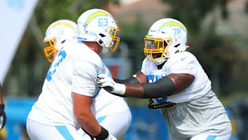 COSTA MESA, CALIFORNIA - AUGUST 24: Nathan Gilliam #63 of the Los Angeles Chargers and Trent Scott #78 run a play during Los Angeles Chargers Training Camp at the Jack Hammett Sports Complex on August 24, 2020 in Costa Mesa, California. (Photo by Joe Scarnici/Getty Images)