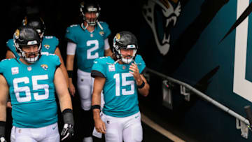 JACKSONVILLE, FLORIDA - OCTOBER 18: Gardner Minshew #15 of the Jacksonville Jaguars and teammates Mike Glennon #2 and Brandon Linder #65 enter the field before the start of a game against the Detroit Lions at TIAA Bank Field on October 18, 2020 in Jacksonville, Florida. (Photo by James Gilbert/Getty Images)