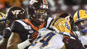 BLACKSBURG, VA - NOVEMBER 23: Offensive lineman Christian Darrisaw #77 of the Virginia Tech Hokies blocks linebacker Phil Campbell III #24 of the Pittsburgh Panthers in the second half at Lane Stadium on November 23, 2019 in Blacksburg, Virginia. (Photo by Michael Shroyer/Getty Images)