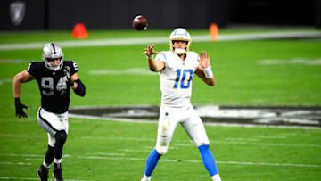 LAS VEGAS, NEVADA - DECEMBER 17: Justin Herbert #10 of the Los Angeles Chargers throws a pass during the first half against the Las Vegas Raiders at Allegiant Stadium on December 17, 2020 in Las Vegas, Nevada. (Photo by Chris Unger/Getty Images)