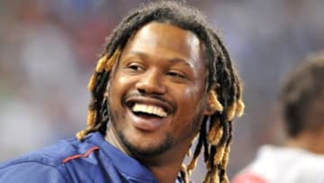 Aug 12, 2015; Miami, FL, USA; Boston Red Sox left fielder Hanley Ramirez (13) looks on from the dugout during the sixth inning against the Miami Marlins at Marlins Park. Mandatory Credit: Steve Mitchell-USA TODAY Sports
