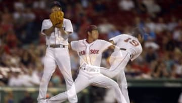 Jul 29, 2015; Boston, MA, USA; A multiple exposure as Boston Red Sox pitcher Koji Uehara (19) delivers a pitch during the ninth inning against the Chicago White Sox at Fenway Park. Mandatory Credit: Greg M. Cooper-USA TODAY Sports