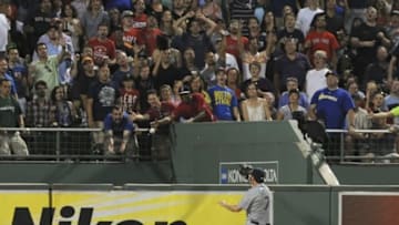 Aug 14, 2015; Boston, MA, USA; Seattle Mariners right fielder Seth Smith (7) watches the ball go into the bullpen for a home run by Boston Red Sox first baseman Travis Shaw (not pictured) during the third inning at Fenway Park. Mandatory Credit: Bob DeChiara-USA TODAY Sports