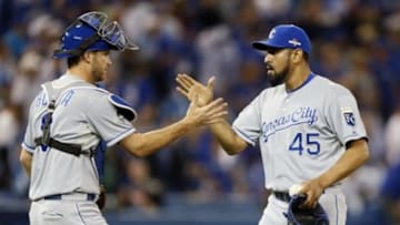 Oct 20, 2015; Toronto, Ontario, CAN; Kansas City Royals relief pitcher Franklin Morales (45) and catcher Drew Butera (9) celebrate the victory against the Toronto Blue Jays in game four of the ALCS at Rogers Centre. Mandatory Credit: John E. Sokolowski-USA TODAY Sports