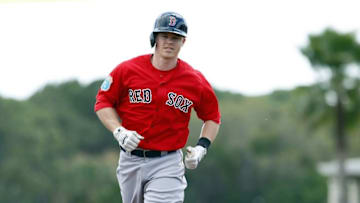 Mar 8, 2016; Sarasota, FL, USA; Boston Red Sox second baseman Brock Holt (12) runs around the bases as he hits a solo home run during the first inning against the Baltimore Orioles at Ed Smith Stadium. Mandatory Credit: Kim Klement-USA TODAY Sports