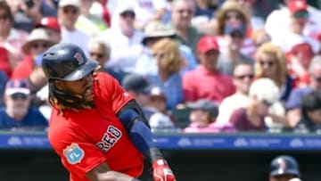 Mar 21, 2016; Jupiter, FL, USA; Boston Red Sox first baseman Hanley Ramirez (13) hits the ball in play against the St. Louis Cardinals during the game at Roger Dean Stadium. The Red Sox defeated the Cardinals 4-3. Mandatory Credit: Scott Rovak-USA TODAY Sports