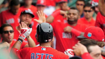 Mar 19, 2016; Fort Myers, FL, USA; Boston Red Sox outfielder Mookie Betts (50) high fives teammates after hitting a home run in the fifth inning against the St. Louis Cardinals at JetBlue Park. The Red Sox won 3-1 as the game was cancelled after five innings due to inclement weather. Mandatory Credit: Evan Habeeb-USA TODAY Sports