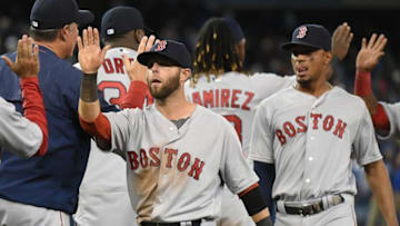 Apr 9, 2016; Toronto, Ontario, CAN; Boston Red Sox second baseman Dustin Pedroia (15) leads shortstop Xander Bogaerts (2) as they greet team mates after a 8-4 win over Toronto Blue Jays at Rogers Centre. Mandatory Credit: Dan Hamilton-USA TODAY Sports