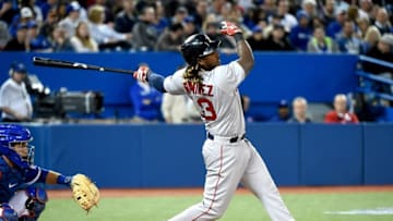 Apr 9, 2016; Toronto, Ontario, CAN; Boston Red Sox designated hitter Hanley Ramirez (13) hits a triple to score two runs against Toronto Blue Jays in the fifth inning at Rogers Centre. Mandatory Credit: Dan Hamilton-USA TODAY Sports