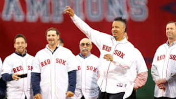 May 28, 2014; Boston, MA, USA; Boston Red Sox former player Manny Ramirez throws out the first pitch before the game against the Atlanta Braves at Fenway Park. Mandatory Credit: Greg M. Cooper-USA TODAY Sports
