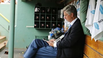 Jul 26, 2015; Boston, MA, USA; Detroit Tigers President, CEO and General Manager Dave Dombrowski works in the dugout before their game against the Boston Red Sox at Fenway Park. Mandatory Credit: Winslow Townson-USA TODAY Sports