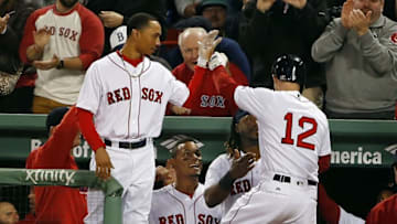 May 9, 2016; Boston, MA, USA; Boston Red Sox left fielder Brock Holt (12) is congratulated by right fielder Mookie Betts (50) after his two-run home run against the Oakland Athletics during the fifth inning at Fenway Park. Mandatory Credit: Winslow Townson-USA TODAY Sports