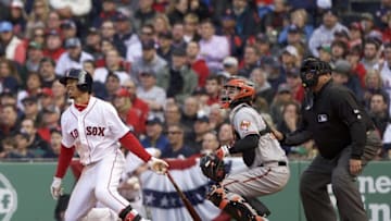 Apr 11, 2016; Boston, MA, USA; Boston Red Sox right fielder Mookie Betts (50) hits a homer against the Baltimore Orioles in the ninth inning at Fenway Park. The Orioles defeated the Red Sox 9-7. Mandatory Credit: David Butler II-USA TODAY Sports