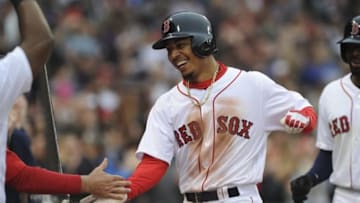 May 21, 2016; Boston, MA, USA; Boston Red Sox right fielder Mookie Betts (50) is greeted in the dugout after hitting a grand slam during the seventh inning against the Cleveland Indians at Fenway Park. Mandatory Credit: Bob DeChiara-USA TODAY Sports