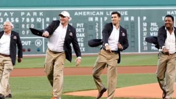 Aug 14, 2014; Boston, MA, USA; Boston Red Sox Hall of Fame Class of 2014, Joseph John Castiglione (left), Roger Clemens, Nomar Garciaparra and Pedro Martinez throw out the first pitch before the game against the Houston Astros at Fenway Park. Mandatory Credit: Greg M. Cooper-USA TODAY Sports