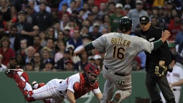 May 10, 2016; Boston, MA, USA; Boston Red Sox catcher Ryan Hanigan (10) tags out Oakland Athletics first baseman Billy Butler (16) during the second inning at Fenway Park. Mandatory Credit: Bob DeChiara-USA TODAY Sports