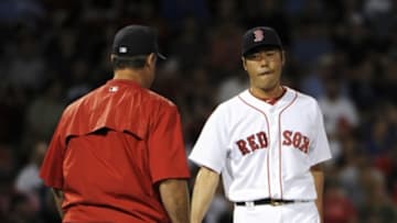 Jun 22, 2016; Boston, MA, USA; Boston Red Sox manager John Farrell (53) relieves relief pitcher Koji Uehara (19) during the eighth inning against the Chicago White Sox at Fenway Park. Mandatory Credit: Bob DeChiara-USA TODAY Sports