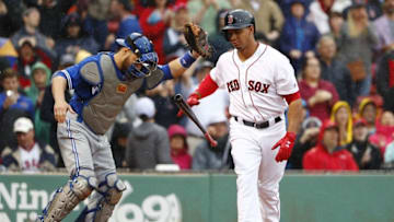 Jun 5, 2016; Boston, MA, USA; Toronto Blue Jays catcher Russell Martin (55) holds up the ball after Boston Red Sox second baseman Marco Hernandez (41) struck out to end the game at Fenway Park. Mandatory Credit: Winslow Townson-USA TODAY Sports