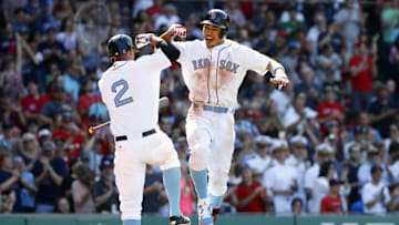 Jun 19, 2016; Boston, MA, USA; Boston Red Sox right fielder Mookie Betts (50) celebrates his solo home run with shortstop Xander Bogaerts (2) against the Seattle Mariners during the seventh inning at Fenway Park. Mandatory Credit: Winslow Townson-USA TODAY Sports