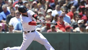 Jul 3, 2016; Boston, MA, USA; Boston Red Sox second baseman Dustin Pedroia (15) hits a single during the third inning against the Los Angeles Angels at Fenway Park. Mandatory Credit: Bob DeChiara-USA TODAY Sports