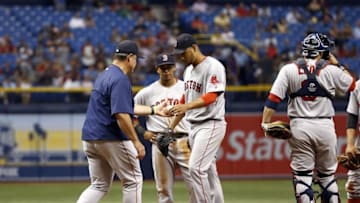 Jun 27, 2016; St. Petersburg, FL, USA; Boston Red Sox manager John Farrell (53) takes out starting pitcher Eduardo Rodriguez (52) during the third inning against the Tampa Bay Rays at Tropicana Field. Mandatory Credit: Kim Klement-USA TODAY Sports