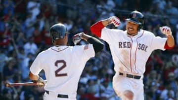 Jul 4, 2016; Boston, MA, USA; Boston Red Sox right fielder Mookie Betts (50) celebrates his two-run home run against the Texas Rangers with shortstop Xander Bogaerts (2) during the eighth inning at Fenway Park. Mandatory Credit: Winslow Townson-USA TODAY Sports