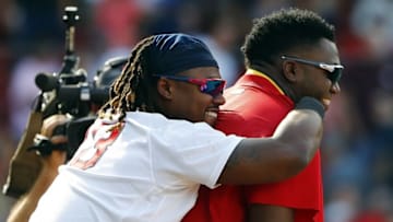 Jul 24, 2016; Boston, MA, USA; Boston Red Sox first baseman Hanley Ramirez (13) hugs designated hitter David Ortiz (34) after the Boston Red Sox 8-7 win over the Minnesota Twins at Fenway Park. Mandatory Credit: Winslow Townson-USA TODAY Sports