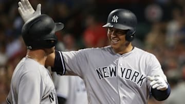 Aug 11, 2016; Boston, MA, USA; New York Yankees designated hitter Alex Rodriguez (right) celebrates with left fielder Brett Gardner (left) after knocking in a run against the Boston Red Sox during the eighth inning at Fenway Park. Mandatory Credit: Mark L. Baer-USA TODAY Sports
