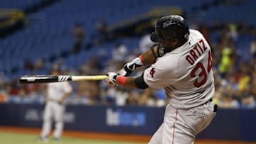 Aug 23, 2016; St. Petersburg, FL, USA; Boston Red Sox designated hitter David Ortiz (34) hits a RBI single during the third inning against the Tampa Bay Rays at Tropicana Field. Mandatory Credit: Kim Klement-USA TODAY Sports