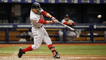 Aug 25, 2016; St. Petersburg, FL, USA; Boston Red Sox right fielder Mookie Betts (50) hits a sacrifice RBI during the sixth inning against the Tampa Bay Rays at Tropicana Field. Mandatory Credit: Kim Klement-USA TODAY Sports