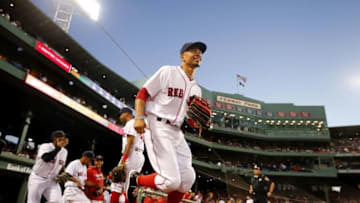 Sep 13, 2016; Boston, MA, USA; Boston Red Sox right fielder Mookie Betts (50) and his teammates take the field before their game against the Baltimore Orioles at Fenway Park. Mandatory Credit: Winslow Townson-USA TODAY Sports